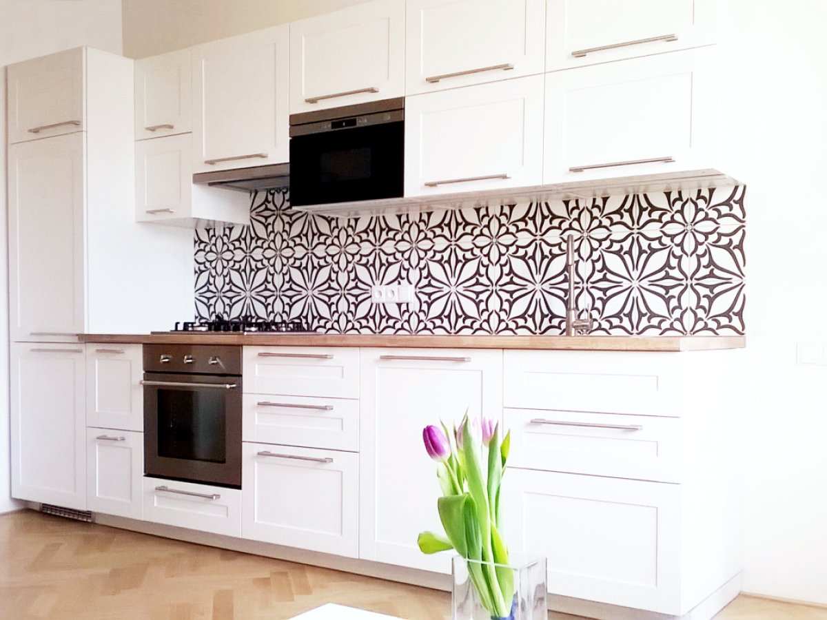 flat retro reconstruction bytu in Prague for rent  airbnb livingroom and kitchen black and white tiles